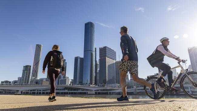 Exercising beside Brisbane River. Picture: Glenn Hunt