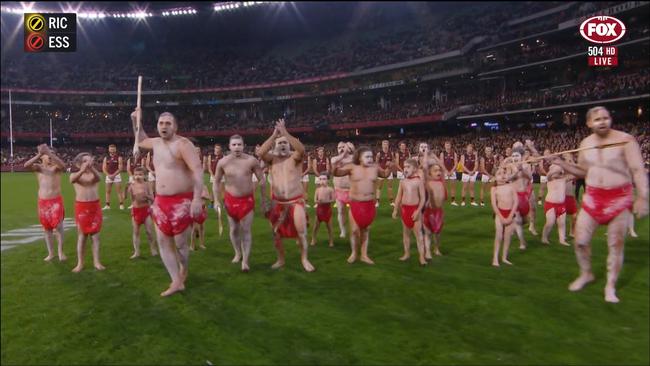 Essendon players support a traditional war dance. Photo: Fox Footy.