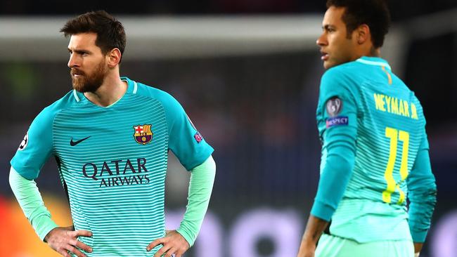 Lionel Messi and Neymar of Barcelona look on.