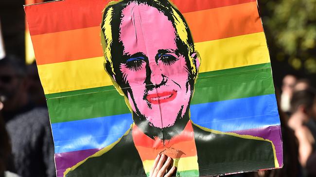 Malcolm Turnbull gets the rainbow treatment during a marriage equality march to Parliament House. Picture: Ellen Smith