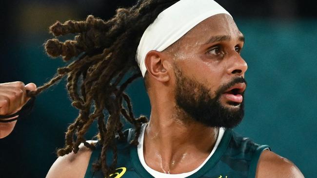 Australia's #05 Patty Mills reacts after in the men's quarterfinal basketball match between Serbia and Australia during the Paris 2024 Olympic Games at the Bercy  Arena in Paris on August 6, 2024. (Photo by Aris MESSINIS / AFP)