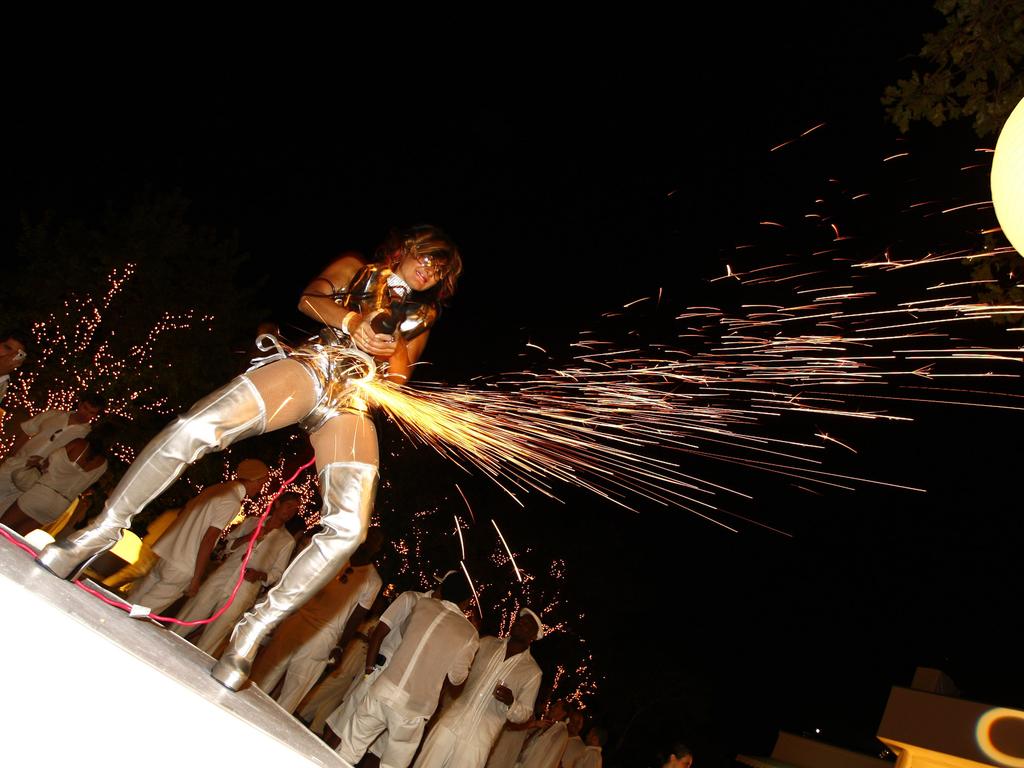 A model is seen setting off a light show with some power tools at a 2007 party. Picture: Mat Szwajkos/CP/Getty Images