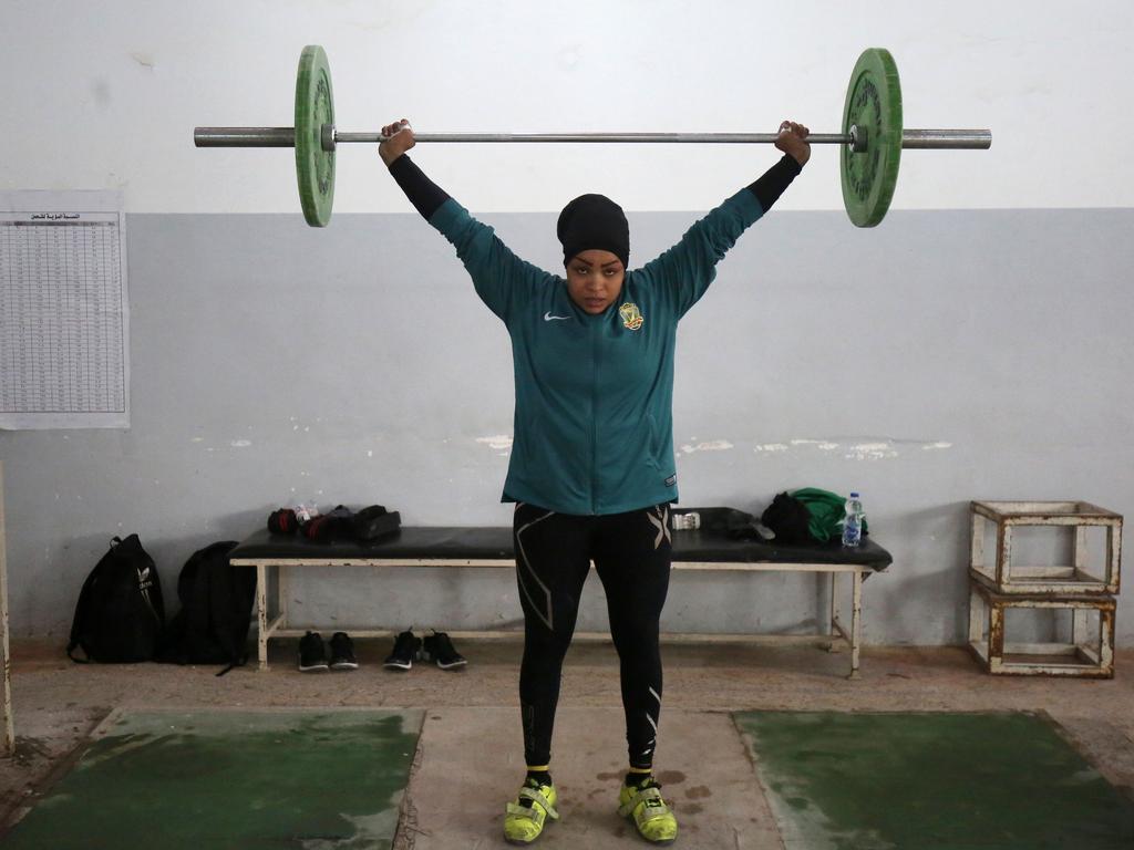 Huda Salem, a 20-year-old member of the Iraqi national weightlifting team, lifts weights as she trains at a gym in Baghdad on February 22, 2018. Picture: AFP