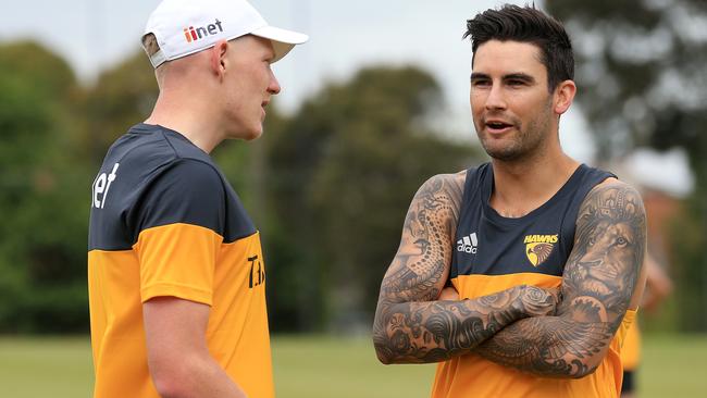 James Sicily and Chad Wingard discuss the cold at Hawthorn’s preseason training session today. Picture: Mark Stewart