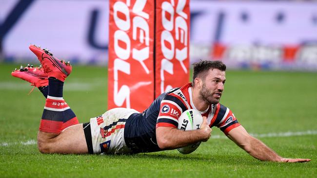 Roosters fullback James Tedesco scores one of his three tries on Monday night