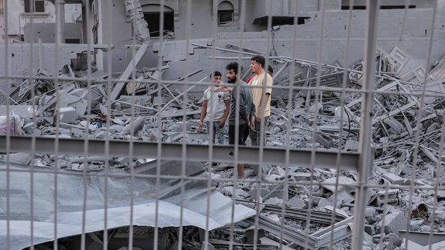 People search rubble for survivors and the bodies of victims in the aftermath of an Israeli bombardment. Picture: AFP