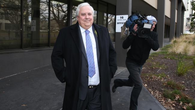 Clive Palmer leaves the Palmer United Party’s offices in Canberra yesterday.