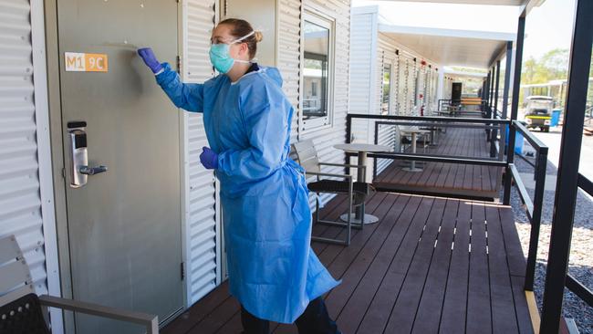 A health worker checking in on a Howard Springs quarantine facility resident.