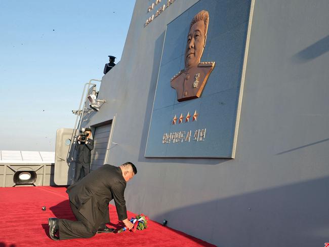 Kim Jong-un laying flowers at the memorial plaque of anti-Japanese revolutionary fighter Choe Hyon during the launch ceremony of a newly-built destroyer in April. Picture: KCNA VIA KNS/AFP