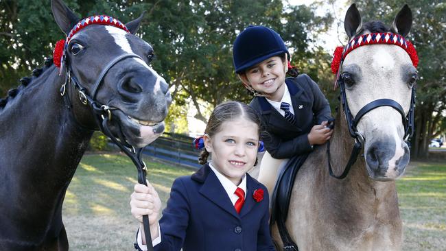 Indie Smith, 7, and Chanelle Lovelock, 8, prepare for the Gold Coast Show. Picture: Tertius Pickard.