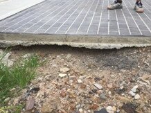 Ground settlement beneath a driveway on Navy Rd, just around the corner from a demolished house in Jordan Springs East. Picture: Supplied.