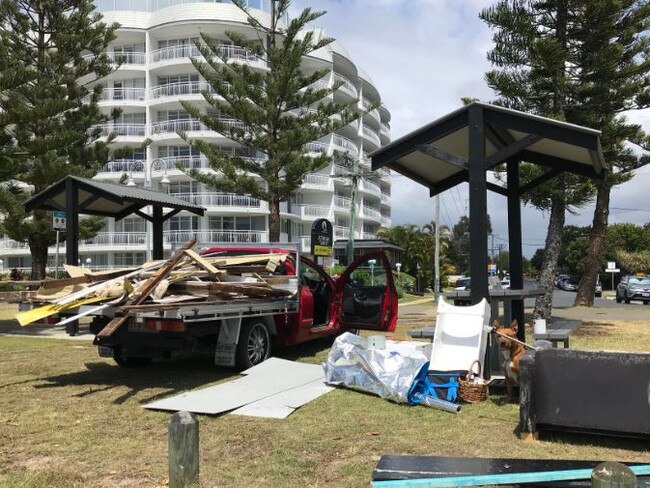 The house boat owners ute piled with debris from his crumbled houseboat at Biggera Waters. Photo: Emily Halloran