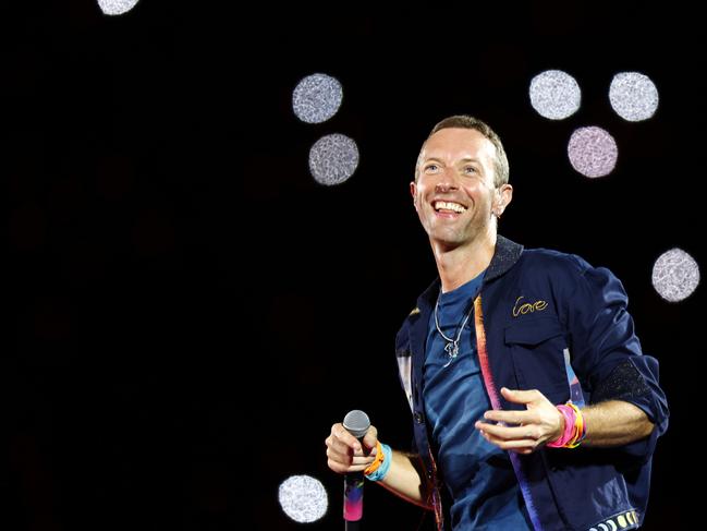 Chris Martin from Coldplay on stage at Accor Stadium at Sydney Olympic Park for their Music Of The Spheres World Tour concert. Picture: Jonathan Ng