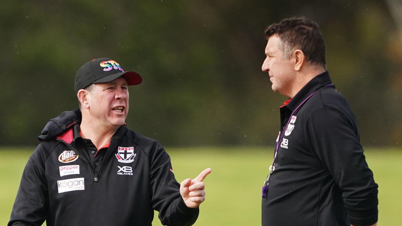 Saints coach Brett Ratten speaks to assistant Brendon Lade at a training session.