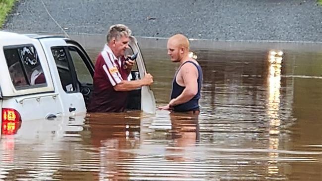 A 4WD partially submerged in floodwaters at Stewart Valley Rd, Goodger, after its driver tried to cross the flooded road as the South Burnett was inundated for a second day by wild weather. Picture: Tammie Scholl, Facebook.