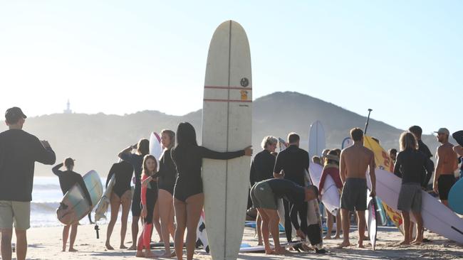 Participants in a paddle-out protest in Byron Bay to oppose the Netflix reality show, Byron Baes. Picture: Liana Boss