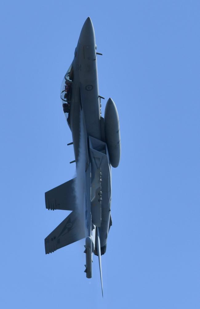 An RAAF EA-18G Growler performs ‘a vertical departure’ over Brisbane during a final rehearsal for Riverfire on September 28, 2018. Picture: AAP Image/Darren England.