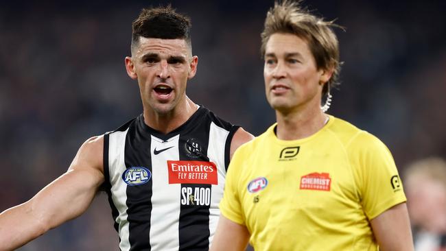 MELBOURNE, AUSTRALIA - AUG 03: Scott Pendlebury of the Magpies speaks with AFL Field Umpire, Robert Findlay during the 2024 AFL Round 21 match between the Collingwood Magpies and the Carlton Blues at The Melbourne Cricket Ground on August 03, 2024 in Melbourne, Australia. (Photo by Michael Willson/AFL Photos via Getty Images)