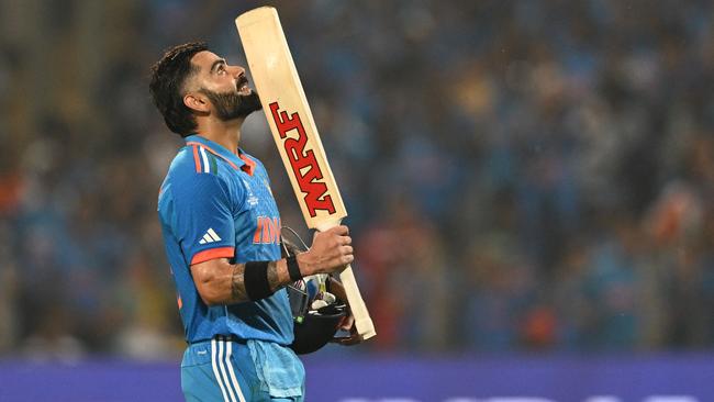 Kohli reached his century right at the death. (Photo by Punit PARANJPE / AFP)