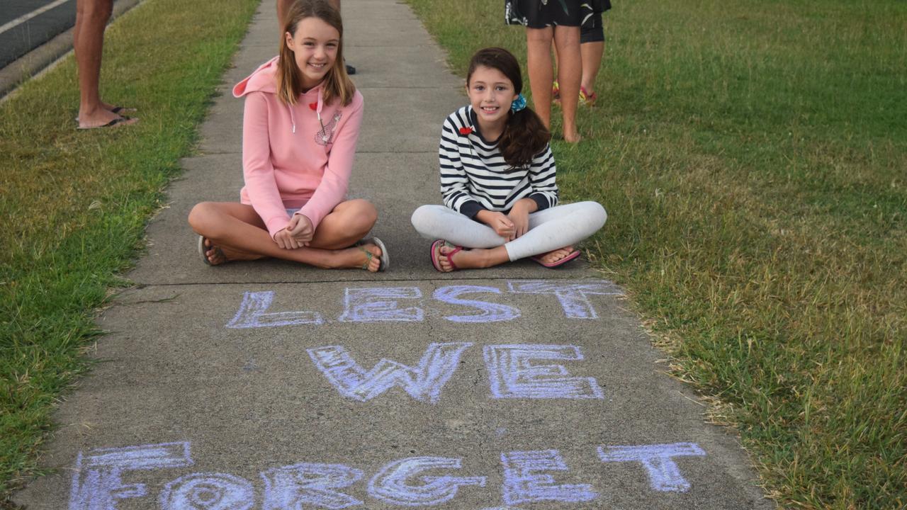 Emily (12) and Charlotte Grice (10) decorated the path as part of this morning's Anzac Day service.