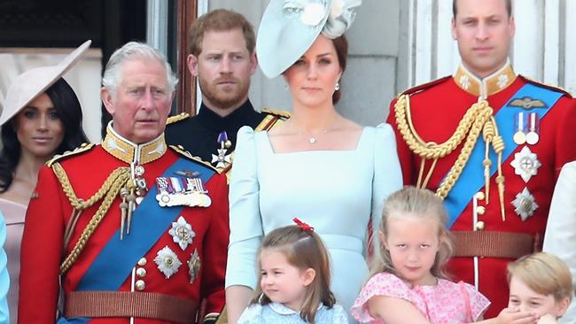 LONDON, ENGLAND - JUNE 09:  Meghan, Duchess of Sussex, Prince Charles, Prince of Wales, Prince Harry, Duke of Sussex, Catherine, Duchess of Cambridge, Princess Charlotte of Cambridge, Savannah Phillips, Prince George of Cambridge watch the flypast on the balcony of Buckingham Palace during Trooping The Colour on June 9, 2018 in London, England. The annual ceremony involving over 1400 guardsmen and cavalry, is believed to have first been performed during the reign of King Charles II. The parade marks the official birthday of the Sovereign, even though the Queen's actual birthday is on April 21st.  (Photo by Chris Jackson/Getty Images)