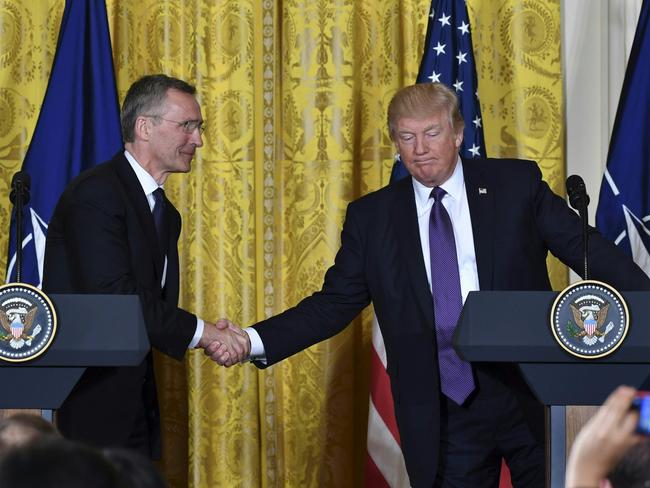 US President Donald Trump (right) and NATO Secretary General Jens Stoltenberg shake hands during a joint press conference at the White House. Picture: AFP/Nicholas Kamm