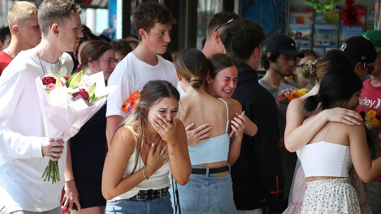 Friends of murder victim Jack Beasley pay their respects at the scene of the tragedy outside the Surfers Paradise IGA in 2019. Picture: Liam Kidston