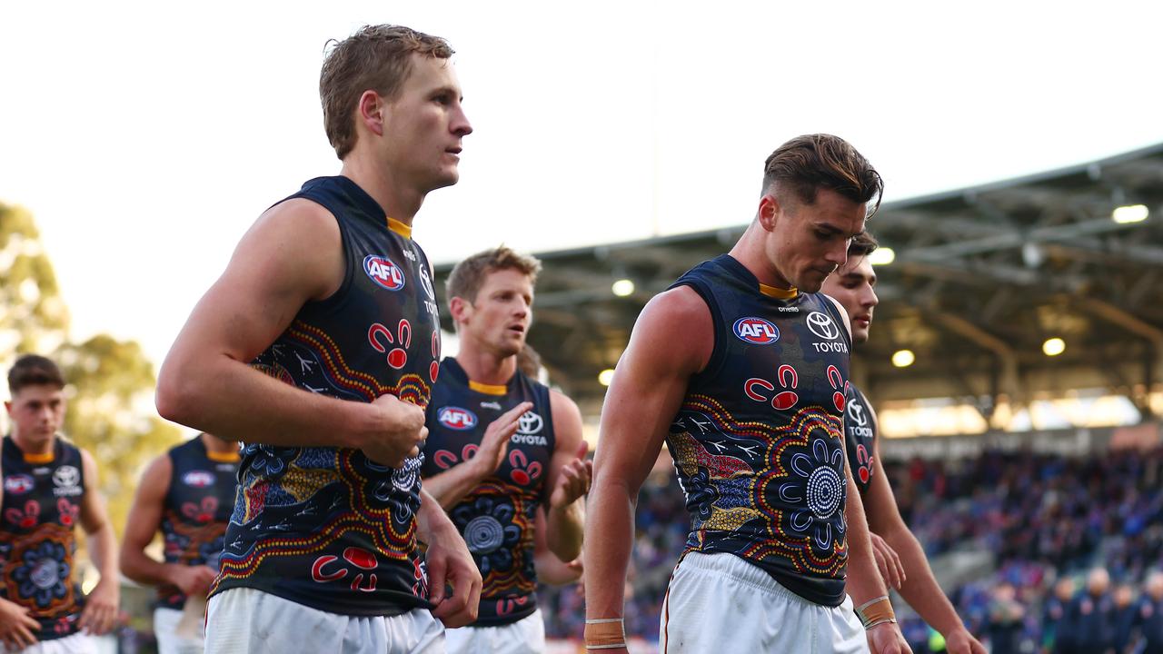 Crows players walk off after the loss. Picture: Graham Denholm/AFL Photos via Getty Images