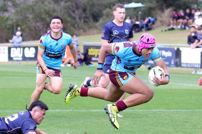 Joseph Tupuse about to score a try (pink headgear). Photo Steve Pohlner