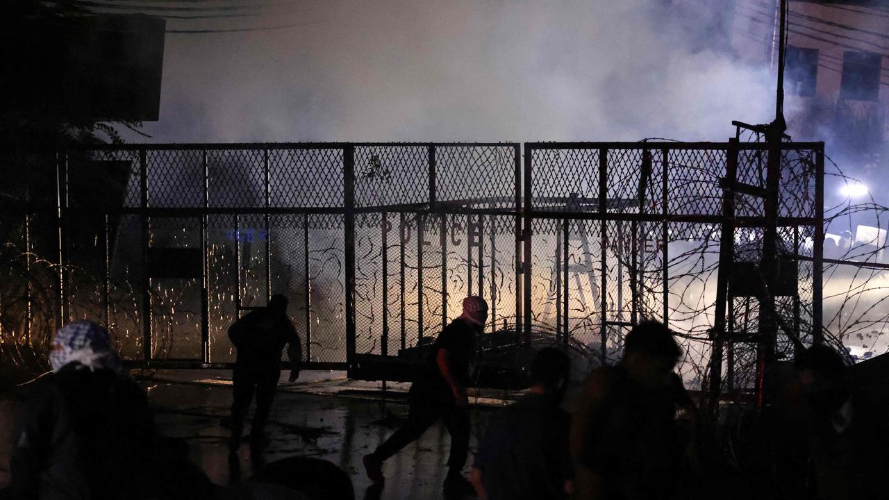 Protesters throw bricks at the US Embassy during a protest in solidarity with the people of Gaza in Awkar, East of Beirut. Picture: AFP