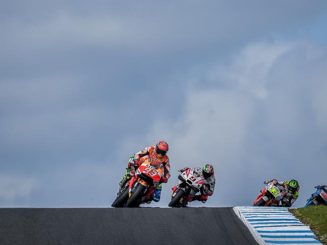 Marc Marquez powers over the crest of Lukey Heights at the 2016 MotoGP. Picture: Jake Nowakowski