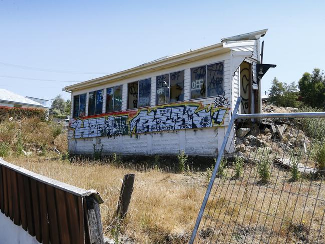 After the house was excavated, vandals left the site defaced with graffiti and broken windows. Picture: MATT THOMPSON