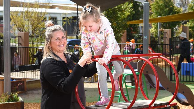 Ms Murphy helps Charlotte on the play equipment. Picture: Josie Hayden