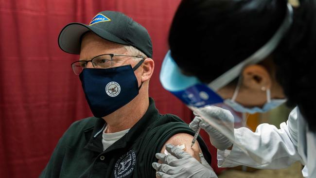 Acting Secretary of Defence Christopher Miller gets his first shot of the Pfizer-BioNTech COVID-19 vaccine. Picture: AFP