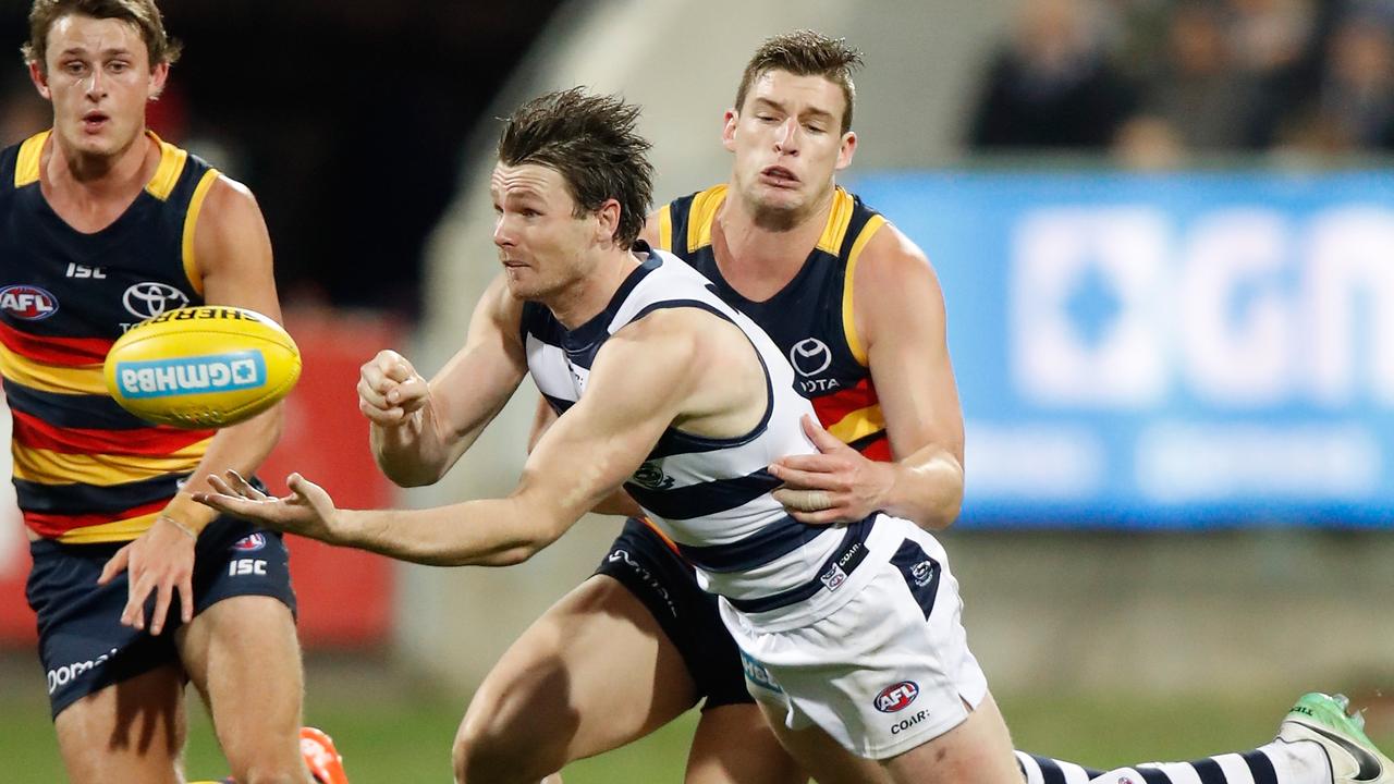 Patrick Dangerfield is tackled by Josh Jenkins in 2017.