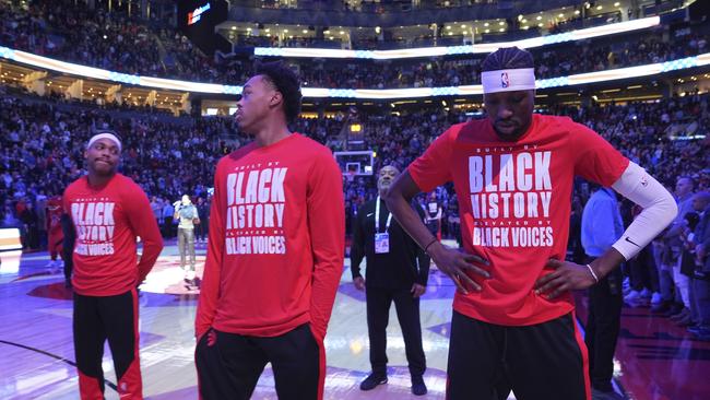 Toronto Raptors forwards Bruce Brown, Scottie Barnes and Chris Boucher react as fans boo the US national anthem before NBA basketball game action against the Los Angeles Clippers in Toronto on February 2. Picture: Frank Gunn/AP