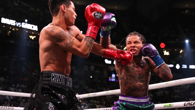 LAS VEGAS, NEVADA - APRIL 22: Ryan Garcia in the black trunks exchanges punches with Gervonta Davis in the green and purple trunks in the first round during their catchweight bout at T-Mobile Arena on April 22, 2023 in Las Vegas, Nevada. (Photo by Al Bello/Getty Images)