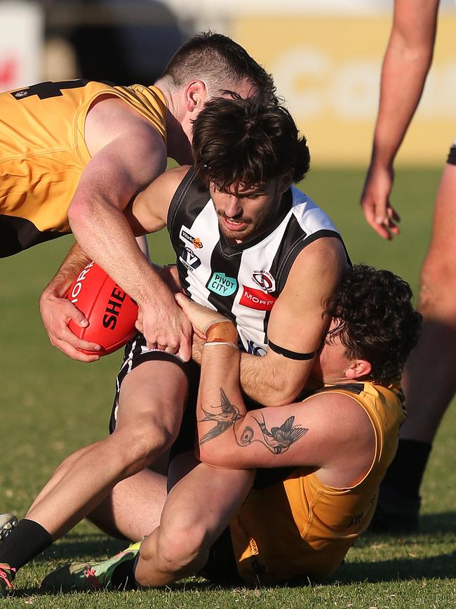North Geelong's Osca Riccardi is trapped by Bannockburn. GDFNL North Geelong v Bannockburn. Picture: Alan Barber