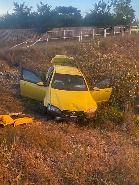 The yellow Holden SS Commodore crashed at the corner of Roystonea Avenue and Owston Avenue. Picture: NT PFES