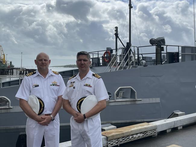 HMAS Cairns new Commanding Officer Andrew Thorpe with outgoing commander Alfonso Santos. Photo: Dylan Nicholson