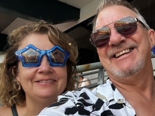 Sunshine Coast parents Kylie Kennedy, left, and Robert Kennedy, middle, with their son Daniel Kennedy at the Elton John concert in Brisbane last Saturday.