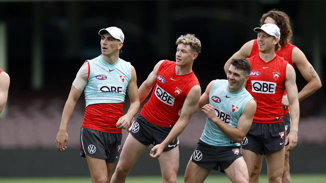 Justin McInerney, Chad Warner, Errol Gulden and Callum Mills enjoy a lighthearted moment at Sydney Swans training. Picture: Phil Hillyard