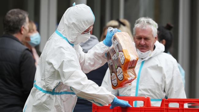 North Melbourne towers receive a food delivery. Picture: David Crosling