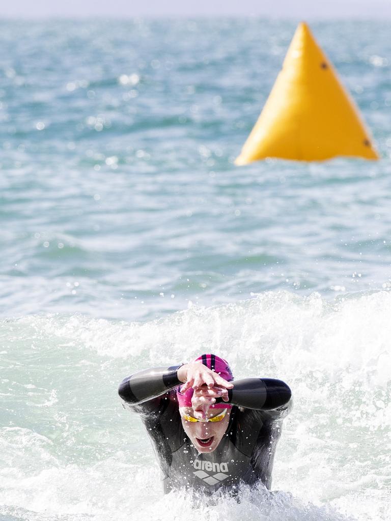 Sam Askey- Doran was first to finish the swim leg during the Seven Mile Beach Gala Day Triathlon. Picture: Chris Kidd