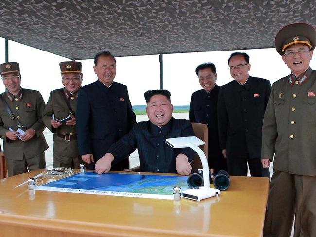 North Korean leader Kim Jong-un smiles during the test launch of a Hwasong-12 intermediate range missile in Pyongyang on Tuesday. Picture: Korean Central News Agency/Korea News Service/AP