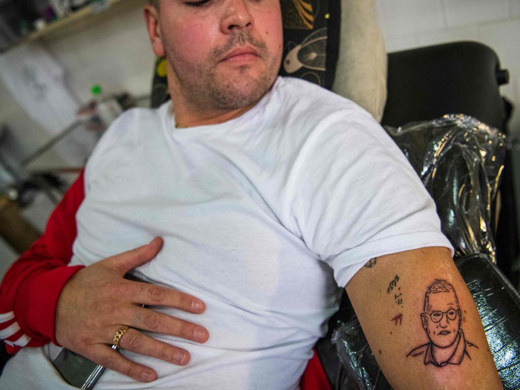 32-years-old Gustav Lloyd Agerblad has a tattoo of Tegnell on his arm. Picture: Jonathan NACKSTRAND / AFP