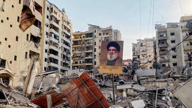 A portrait of slain Hezbollah leader Hassan Nasrallah sits amidst debris in Beirut after Israeli air strikes. Picture: AFP.