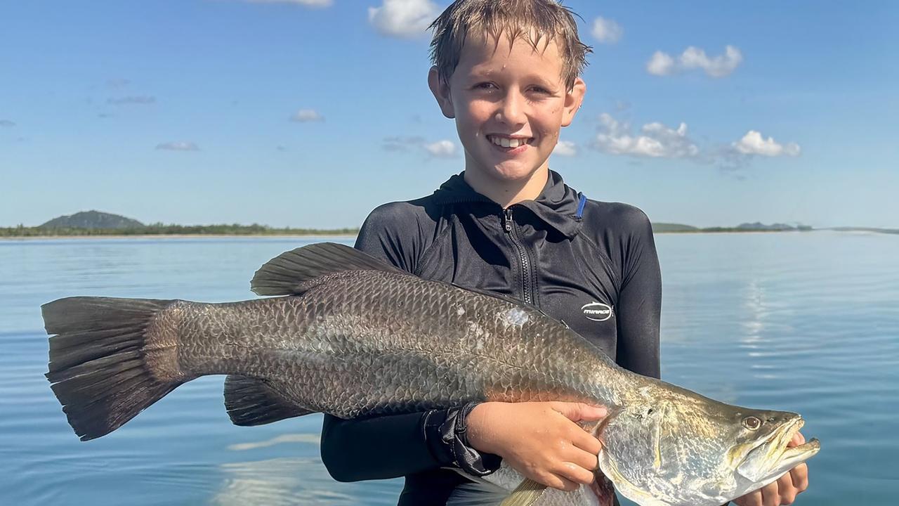 Riley Christensen caught this 85cm barra while fishing in the Elliot River - the fish previously tagged and released into Black Weir - Photo: Suntag Australia.