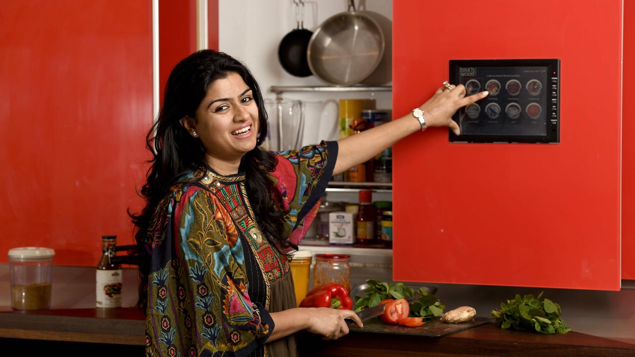 Avid cook Divya Abrol has a fiery red smart kitchen, which is the standout attraction in her Hampton East house that is up for sale. Picture: Naomi Jellicoe