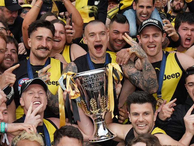 *This picture has been selected as one of the Best of the Year Sports images for 2019*  Tigers players celebrate the win during the 2019 AFL Grand Final between the Richmond Tigers and the GWS Giants at the MCG in Melbourne, Saturday, September 28, 2019. (AAP Image/Michael Dodge) NO ARCHIVING